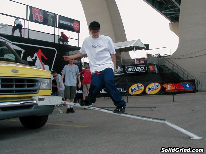 Dude sliding a rail on the Soap Van at the Summer Slam demo