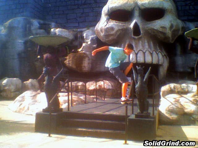 Stuart Pickston grinding a fastslide outside the big skull castle... thing