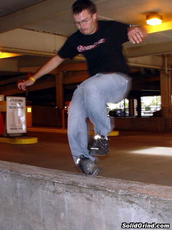 Zach larson with a Christ Grind in a Des Moines parking garage