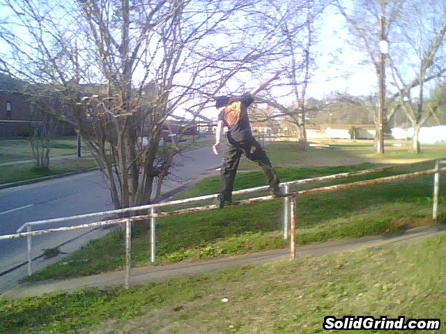 Jay Ericson doing a frontside down a 15ft rail at his school.