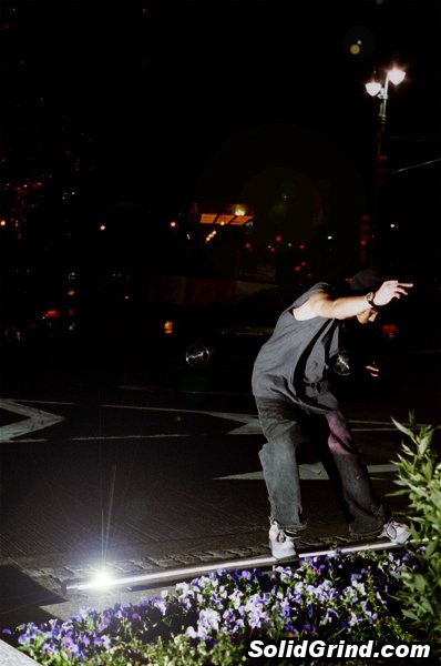 AnthoFlex hitting a frontside on the Columbus Circle White Neon Rail