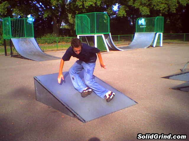 Stuart Pickston with a cess slide down a ramp.