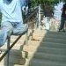 Victor Sierra sticking a Sidewalk on the John Bowne School rail