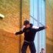 Stuart Pickston doing a cheesegrater on the Chimes shopping centre long rail
