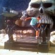 Stuart Pickston grinding a fastslide outside the big skull castle... thing