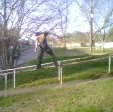 Jay Ericson doing a frontside down a 15ft rail at his school.