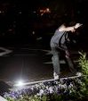 AnthoFlex hitting a frontside on the Columbus Circle White Neon Rail
