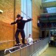 Stuart Pickston doing a cheesegrater on the Chimes shopping centre long rail