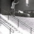 David Plasse sliding a handrail and sportin the afro.
